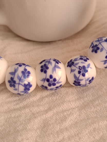 Blue flowers on white beads bracelet