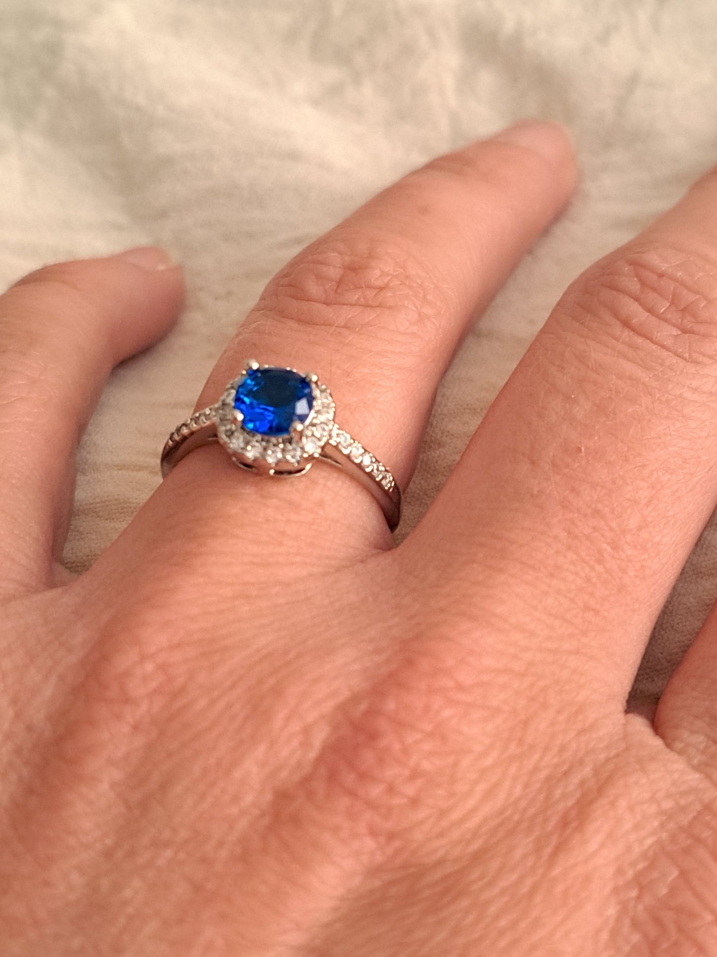 Sapphire blue stone on silver ring